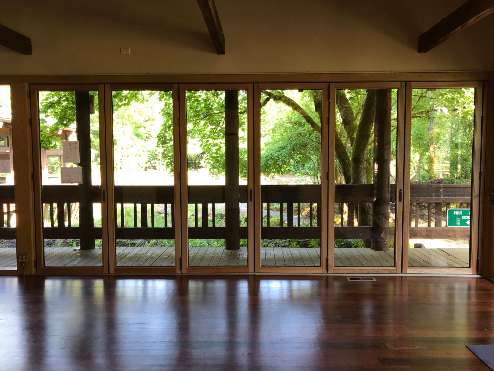 The interior of the Environmental Learning Center's Pavilion, with rows of ceiling-high windows